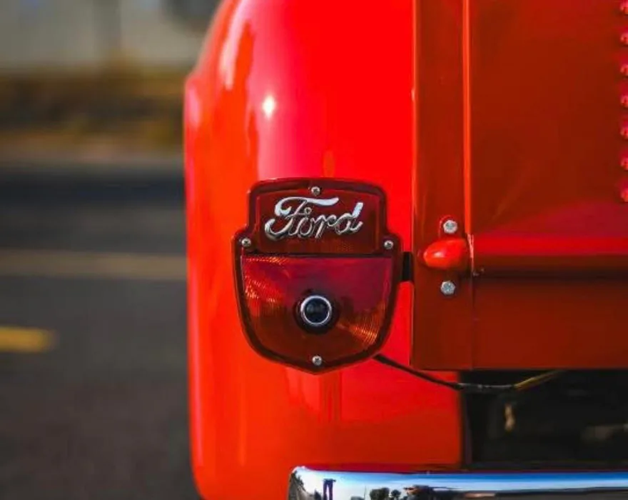 Original Ford badge on restored red paint