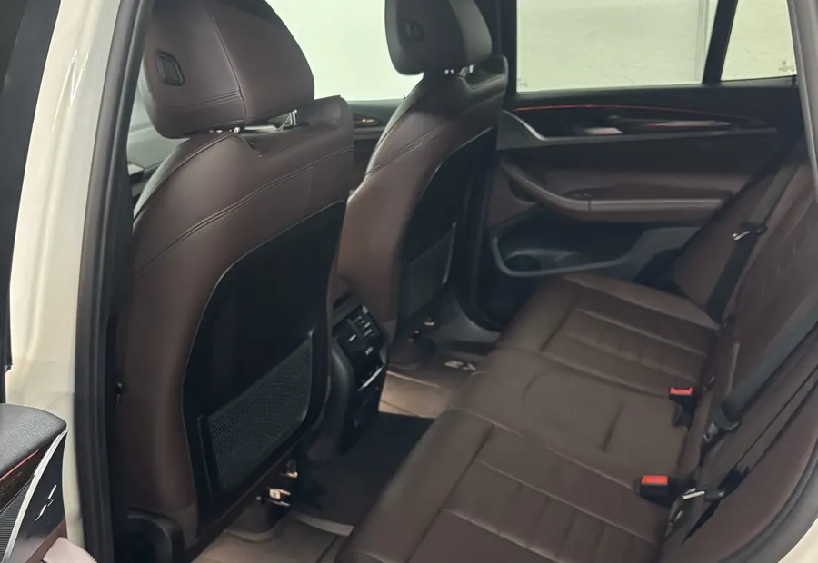 Brown leather rear seats of a BMW X3 after an interior detail