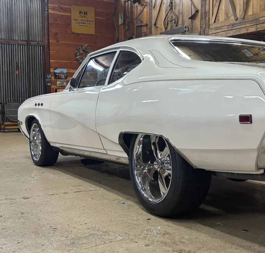 White Chevrolet Chevelle in a barn shop