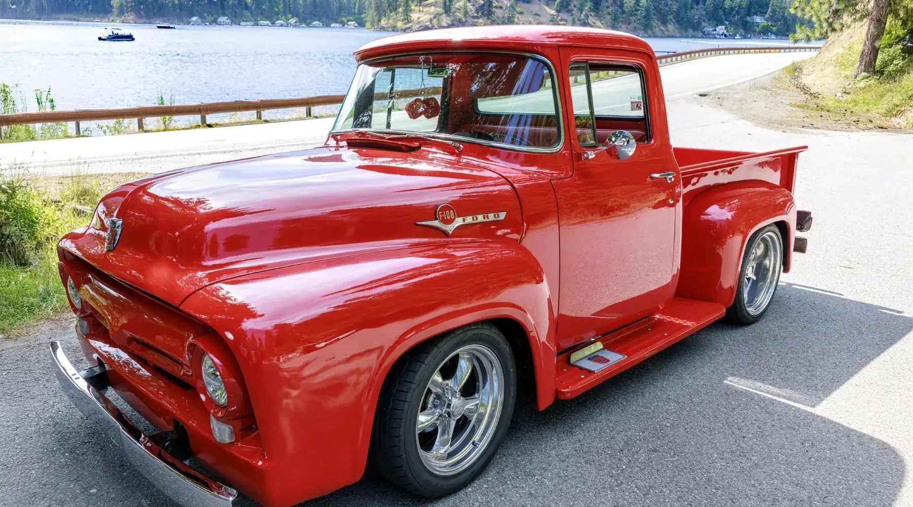 Restored red Ford F-100 pickup on the lake road in Coeur d'Alene